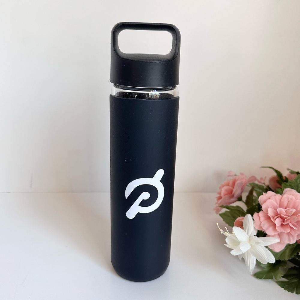 Peloton Glass Bottle Water with Black Silicone Sleeve